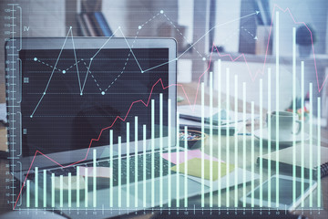 Double exposure of forex chart and work space with computer. Concept of international online trading.