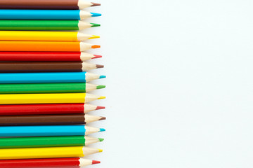 rainbow color pencils on white background