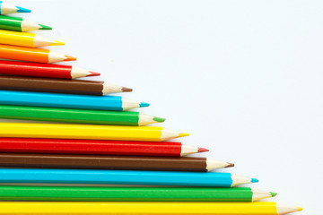 rainbow color pencils on white background