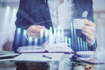 Double exposure of businessman with coffee with stock market forex chart.