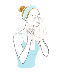スキンケア　タオルで顔を拭く女性