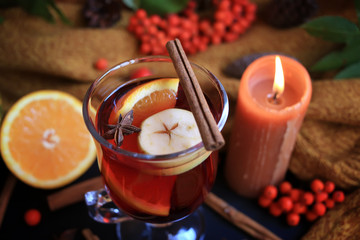 Autumn mulled wine based on red wine with orange, apple and spicy cinnamon sticks, and star anise...