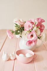 Easter flowers and eggs. Festive Easter spring composition with flowers and eggs. Easter Background. Springtime. Invitation card design with copy space. Easter card template