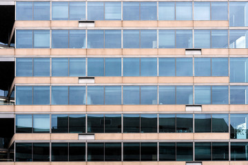 Glass office building facade with windows, texture, architecture - image