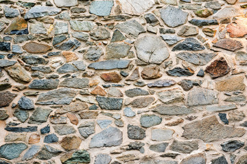 Old, different colors stone wall background texture close up - image
