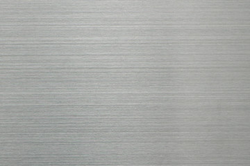 Brushed brushed aluminum surface. Empty abstract background of gray color.
