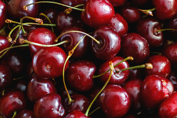 Red berries ripe cherries closeup in full screen. Top view