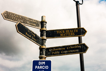 Writing note showing Your Health Matters. Business concept for good health is most important among other things Road sign on the crossroads with blue cloudy sky in the background