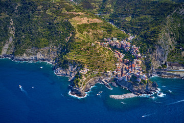 Panorama view of Manarola village one of Cinque Terre in La Spezia, Italy. Flight by a drone.