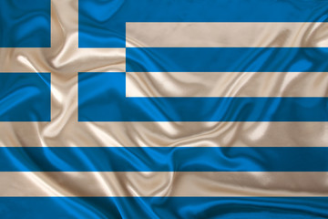 photo of the national flag of the state of Greece on a luxurious texture of satin, silk with waves, folds and highlights, close-up, copy space, illustration