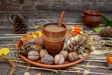 autumn still life with coffee and cones