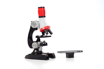 Red Microscope ,science tool on white background.