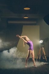 .Dancer, gymnast in a beautiful studio light