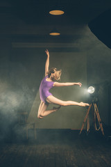.Dancer, gymnast in a beautiful studio light