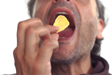 man eating tortilla corn snack