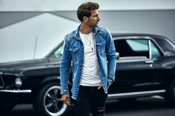 Handsome man with black classic car wear smart casual