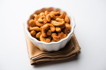 Masala Kaju or spicy Cashew in a bowl. Popular festival snack from India/asia, also known as Chakna recipe