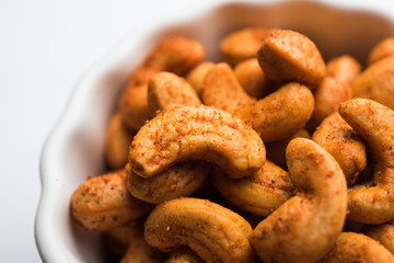 Masala Kaju or spicy Cashew in a bowl. Popular festival snack from India/asia, also known as Chakna recipe