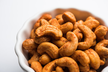 Masala Kaju or spicy Cashew in a bowl. Popular festival snack from India/asia, also known as Chakna recipe