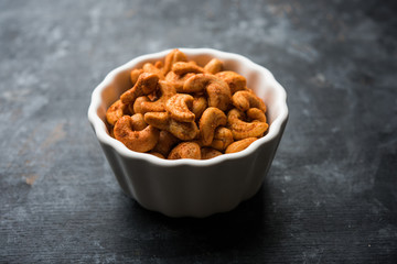 Masala Kaju or spicy Cashew in a bowl. Popular festival snack from India/asia, also known as Chakna recipe