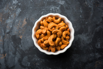 Masala Kaju or spicy Cashew in a bowl. Popular festival snack from India/asia, also known as Chakna recipe
