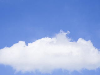 Blue sky background with big white cloud.