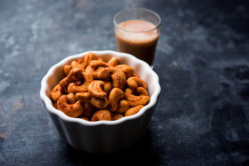 Masala Kaju or spicy Cashew in a bowl. Popular festival snack from India/asia, also known as Chakna recipe