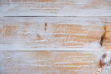 Fototapeta premium natural wooden background in vintage style with traces of white paint and scratches