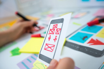 Web designer is developing an application for mobile phones. Creating a layout of the user...