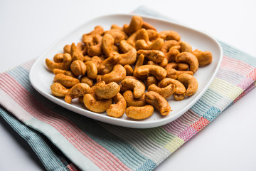 Masala Kaju or spicy Cashew in a bowl. Popular festival snack from India/asia, also known as Chakna recipe