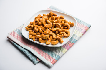 Masala Kaju or spicy Cashew in a bowl. Popular festival snack from India/asia, also known as Chakna recipe