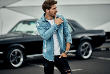 Handsome man with black classic car wear smart casual