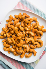 Masala Kaju or spicy Cashew in a bowl. Popular festival snack from India/asia, also known as Chakna...