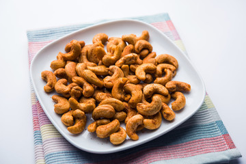 Masala Kaju or spicy Cashew in a bowl. Popular festival snack from India/asia, also known as Chakna recipe