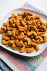 Masala Kaju or spicy Cashew in a bowl. Popular festival snack from India/asia, also known as Chakna recipe