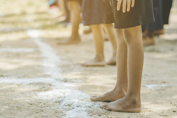Students fitness training for sprinting on an athletic track in school.