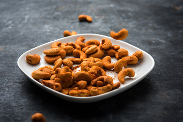 Masala Kaju or spicy Cashew in a bowl. Popular festival snack from India/asia, also known as Chakna recipe