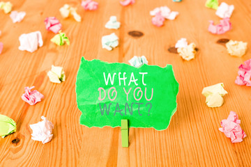 Word writing text What Do You Want Question. Business photo showcasing say or write in order to ask demonstrating about something Colored crumpled papers empty reminder wooden floor background