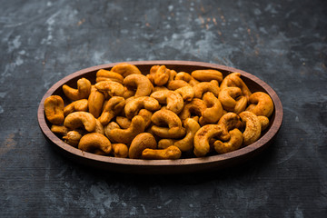 Masala Kaju or spicy Cashew in a bowl. Popular festival snack from India/asia, also known as Chakna recipe