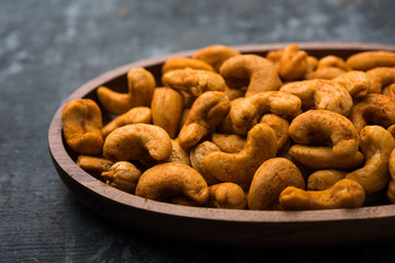 Masala Kaju or spicy Cashew in a bowl. Popular festival snack from India/asia, also known as Chakna recipe