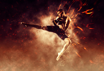MMA male fighter kick. Flames background