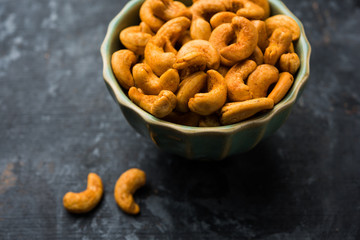 Masala Kaju or spicy Cashew in a bowl. Popular festival snack from India/asia, also known as Chakna recipe