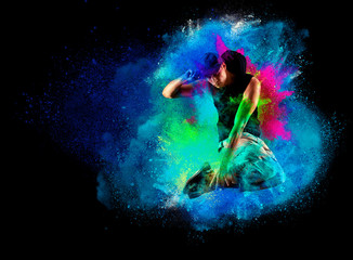 Fototapeta na wymiar Dancer jumping in hoodie with colourful splashes