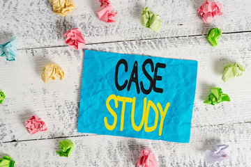 Word writing text Case Study. Business photo showcasing analysis and a specific research design for examining a problem Crumpled colored rectangle square shaped paper reminder white wood desk