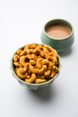 Masala Kaju or spicy Cashew in a bowl. Popular festival snack from India/asia, also known as Chakna recipe