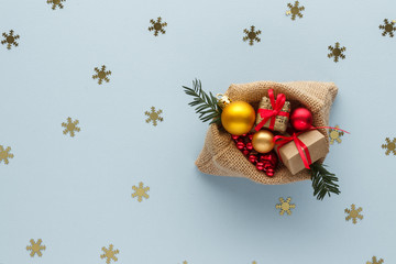 : Christmas composition. Gift box with ribbon and christmas snowflake ball top view background with copy space for your text. Flat lay.