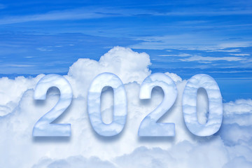 Naklejka na ściany i meble 2020 text over cloudy blue sky for happy new year holiday background.