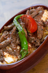 Meatballs with tomato sauce and yogurt in a pan