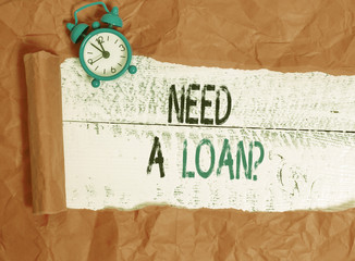 Writing note showing Need A Loanquestion. Business concept for offering a money for demonstratingal or business finances
