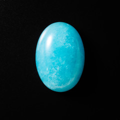 AMAZONITE stone on black background.